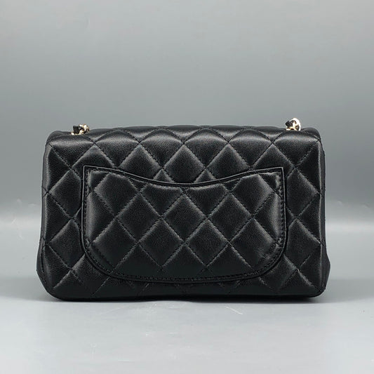 Chanel lambskin quilted mini rectangular flap bag in black with CC logo chain