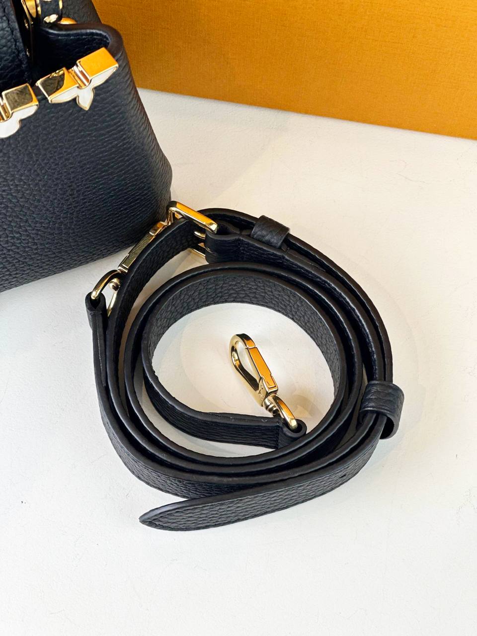 LOUIS VUITTON CAPUCINES MINI MOTHER OF PEARL MONOGRAM FLOWERS BLACK TAURILLON LEATHER HANDBAG WITH STRAP