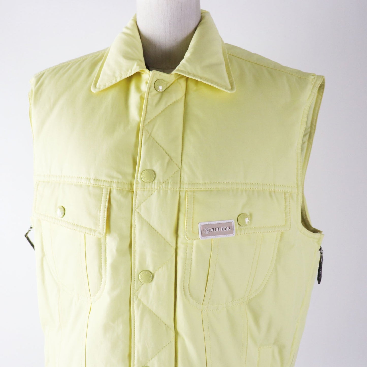LOUIS VUITTON Down vest Outer: 100% cotton, Lining: 75% polyester, Lining: 25% acrylic, Filling: 90% down, Filling: 10% feather, Part: PVC Light yellow Women 34