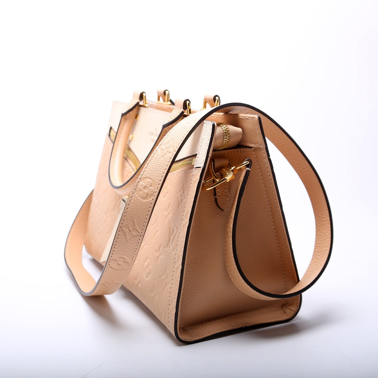 Louis Vuitton Sully PM Empreinte Peach/Cream