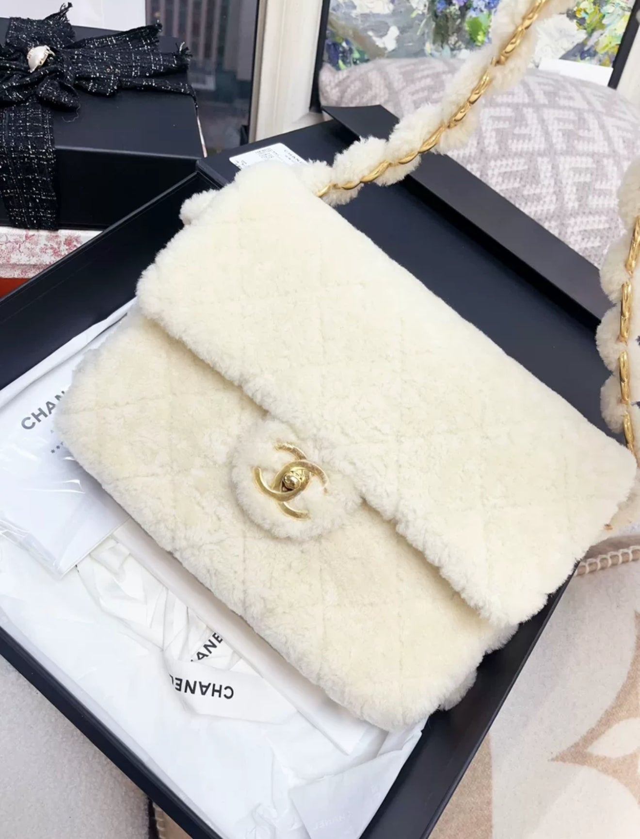 Chanel 24K off-white shearling chain flap bag with gold hardware