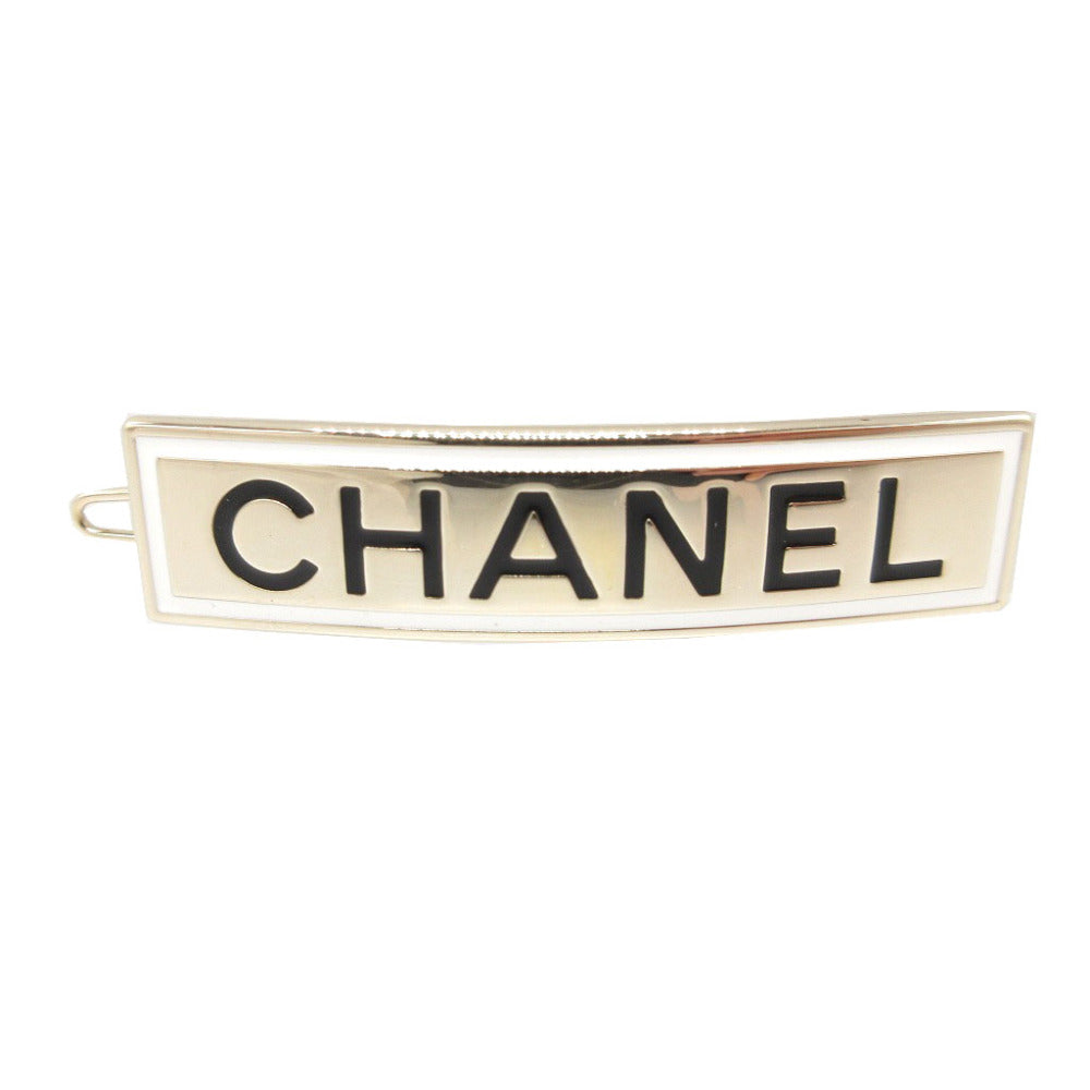 CHANEL Valletta metal gold logo plate hair accessory Women