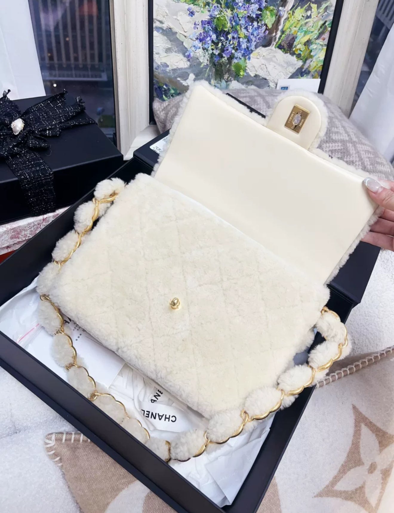 Chanel 24K off-white shearling chain flap bag with gold hardware