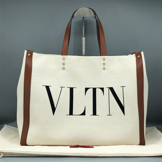 Valentino Garavani VLTN Grande Plage tote features canvas Cream/Caramel