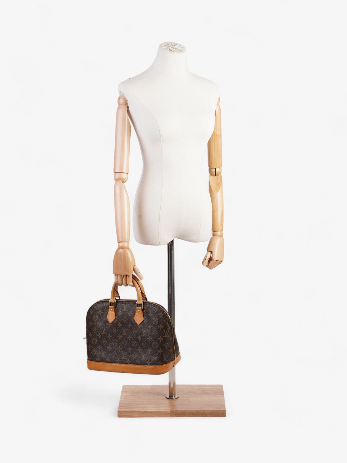 Louis Vuitton Alma Monogram Coated Canvas PM