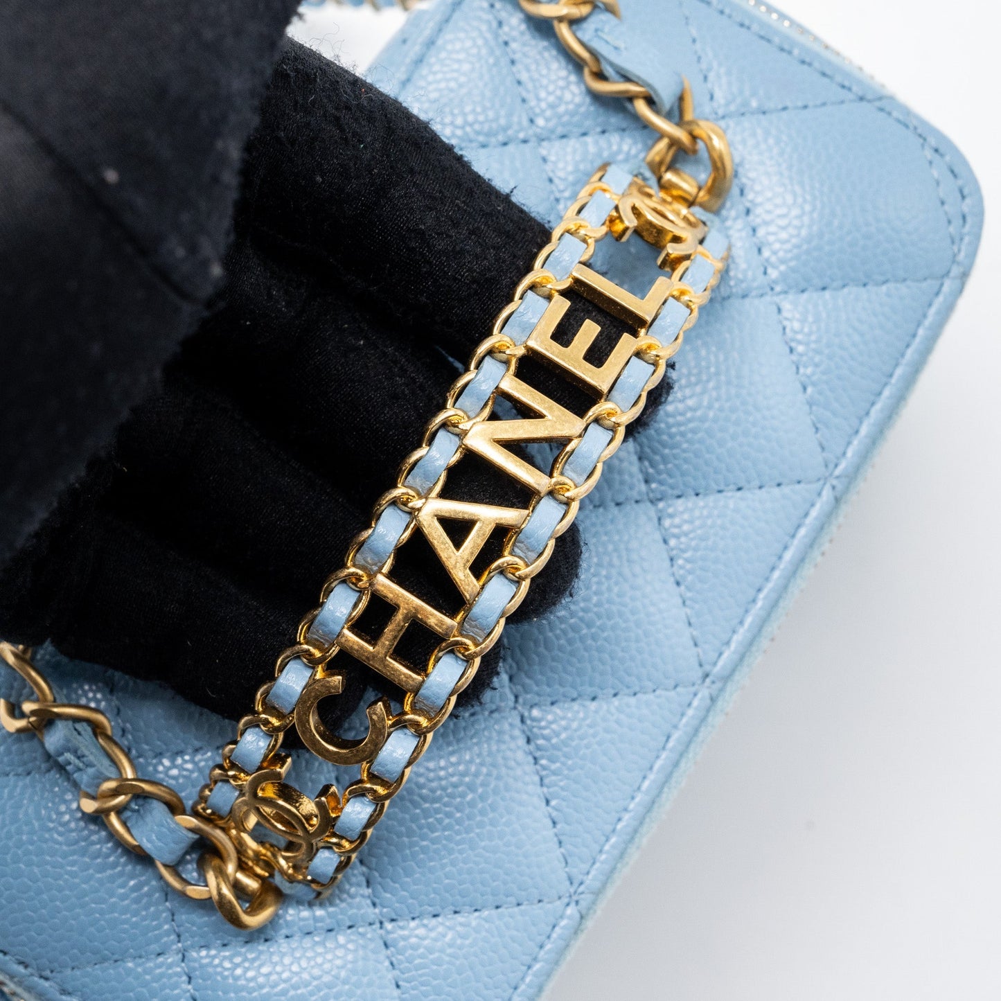 Chanel detailed top handle long vanity with chain caviar light blue
