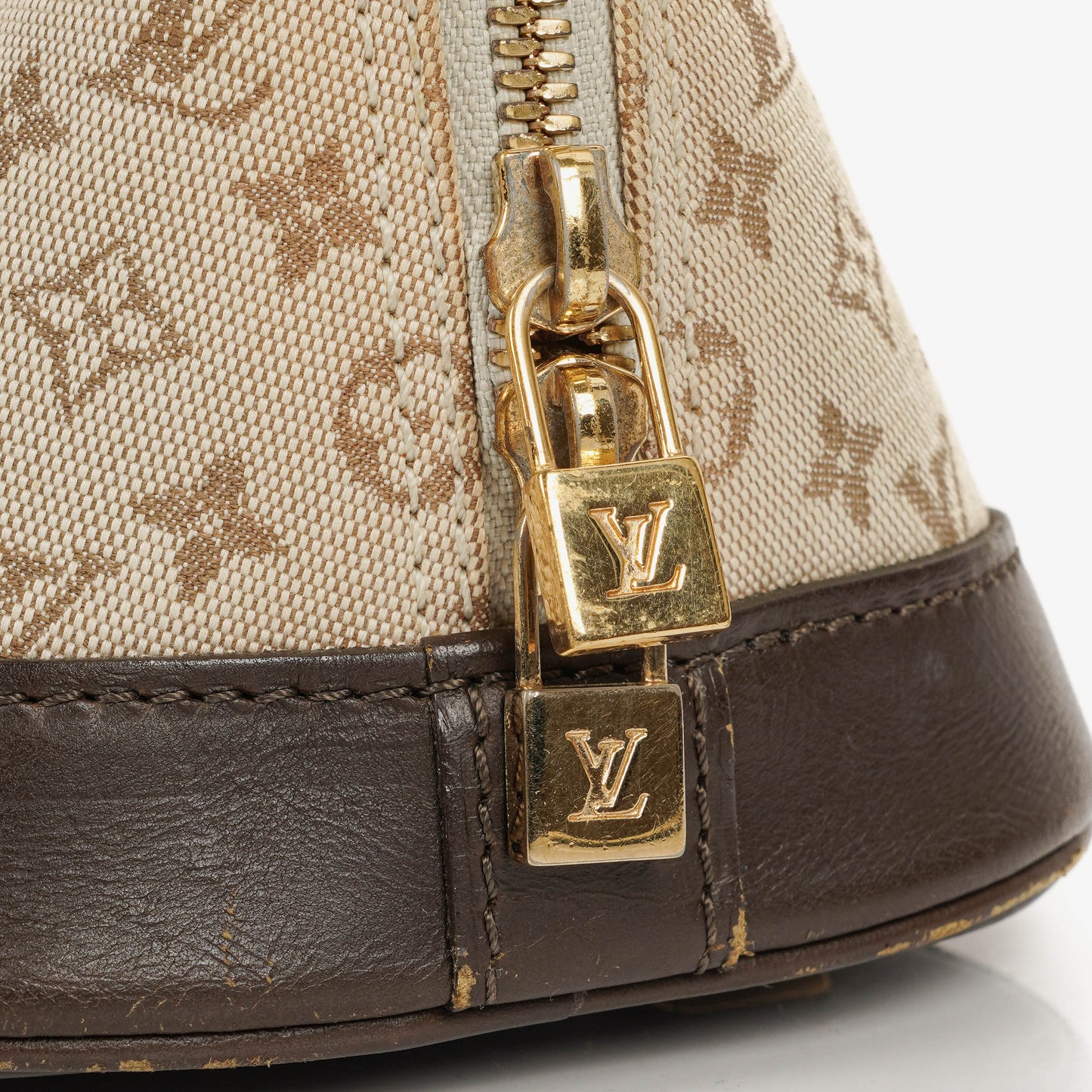 Louis Vuitton Alma Long Brown Monogram Mini Lin Handbag