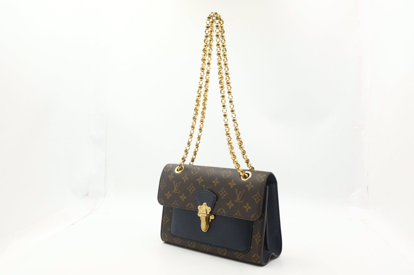 Louis Vuitton Victoire in Monogram Canvas & Blue Leather