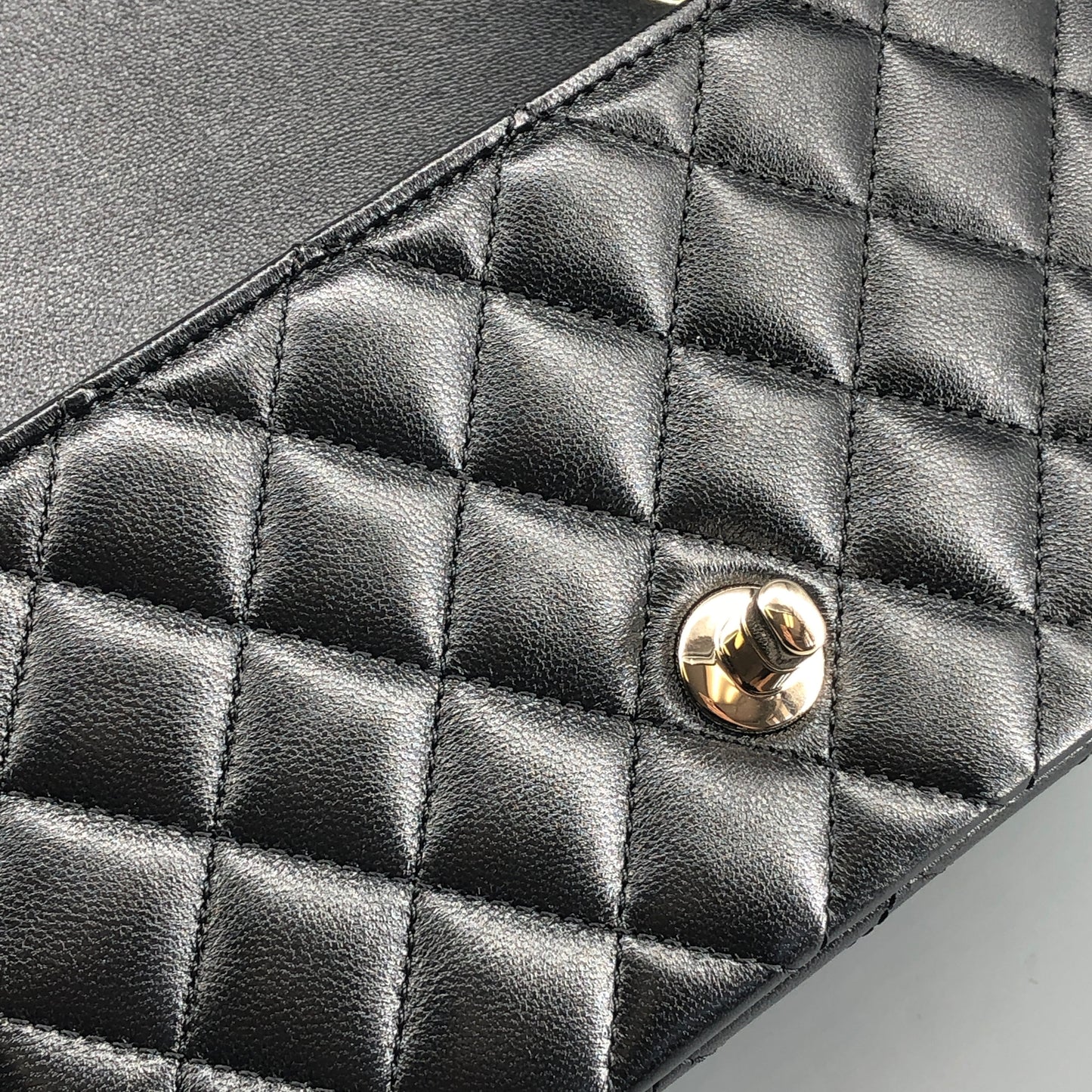 Chanel lambskin quilted mini rectangular flap bag in black with CC logo chain