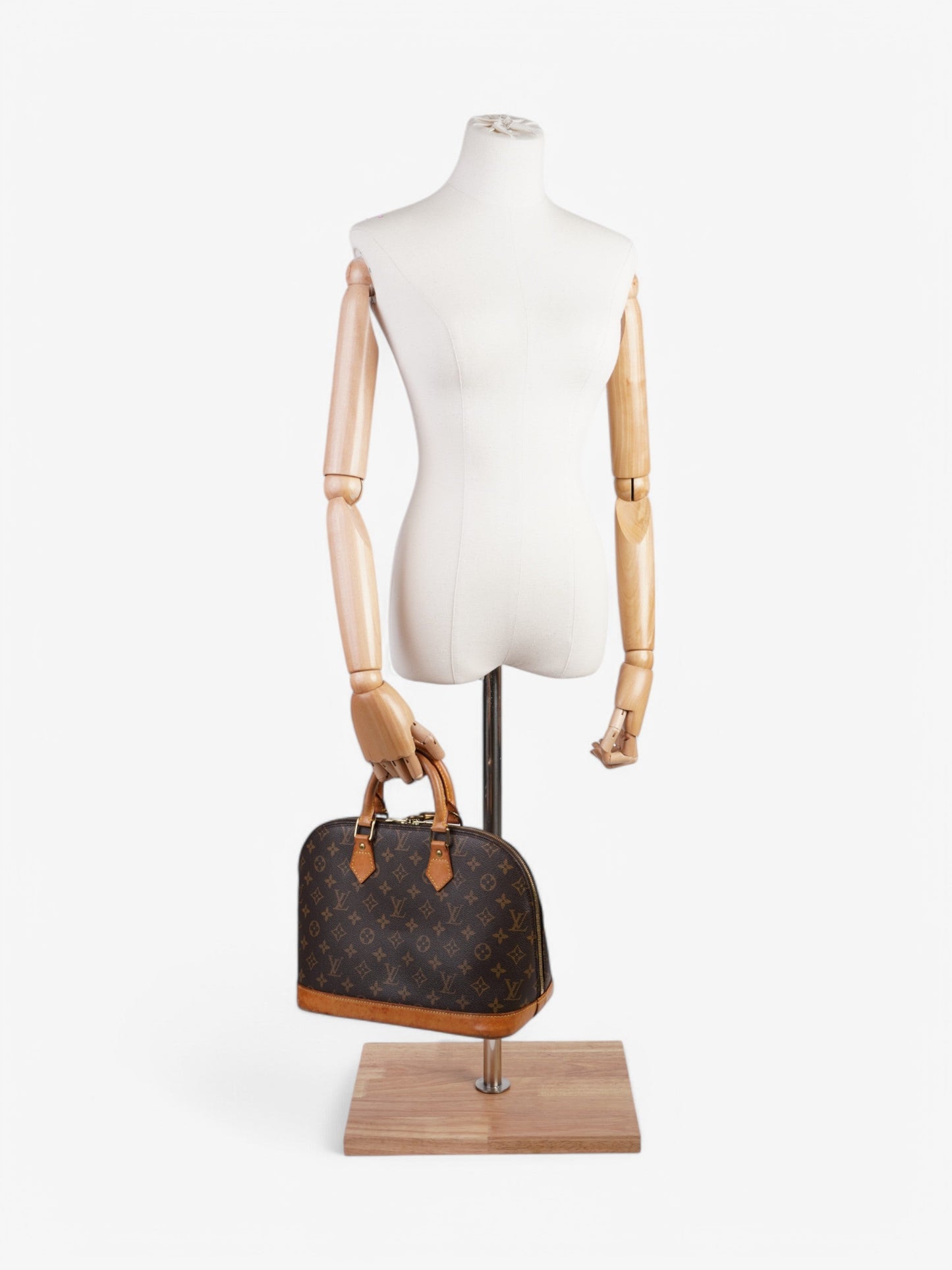 Louis Vuitton Alma Monogram Coated Canvas PM
