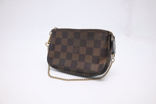 Louis Vuitton Mini Pochette Accessoires in Damier Ebene Canvas
