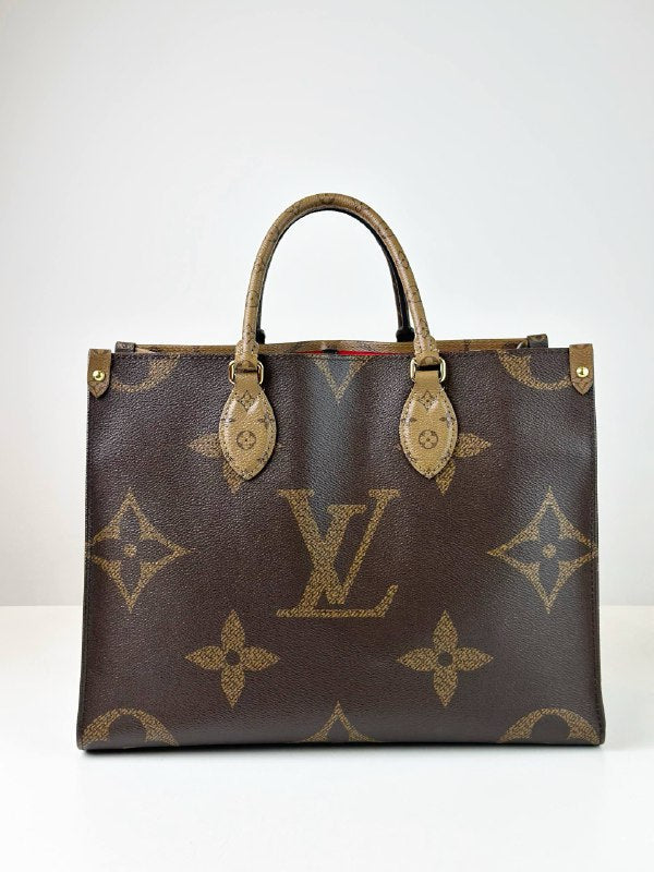 LOUIS VUITTON ON THE GO MM REVERSE MONOGRAM HANDBAG
