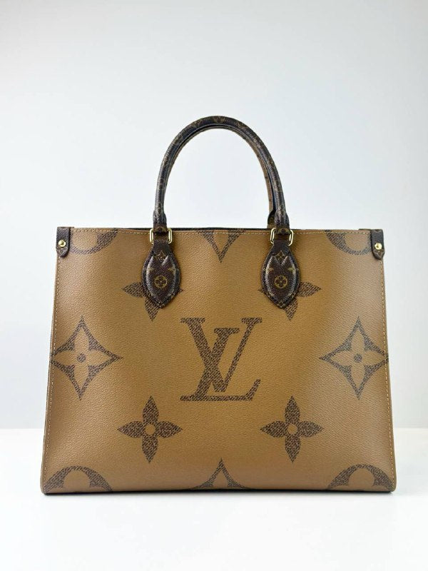 LOUIS VUITTON ON THE GO MM REVERSE MONOGRAM HANDBAG
