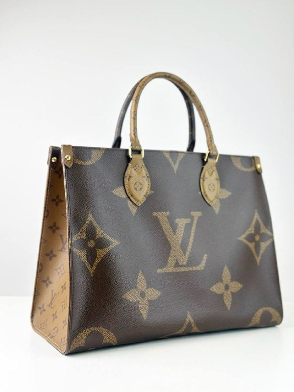 LOUIS VUITTON ON THE GO MM REVERSE MONOGRAM HANDBAG