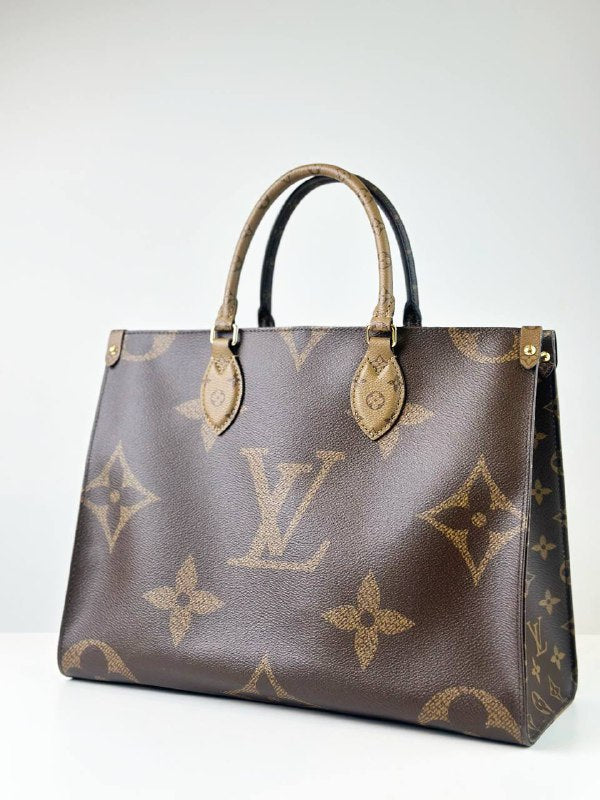 LOUIS VUITTON ON THE GO MM REVERSE MONOGRAM HANDBAG