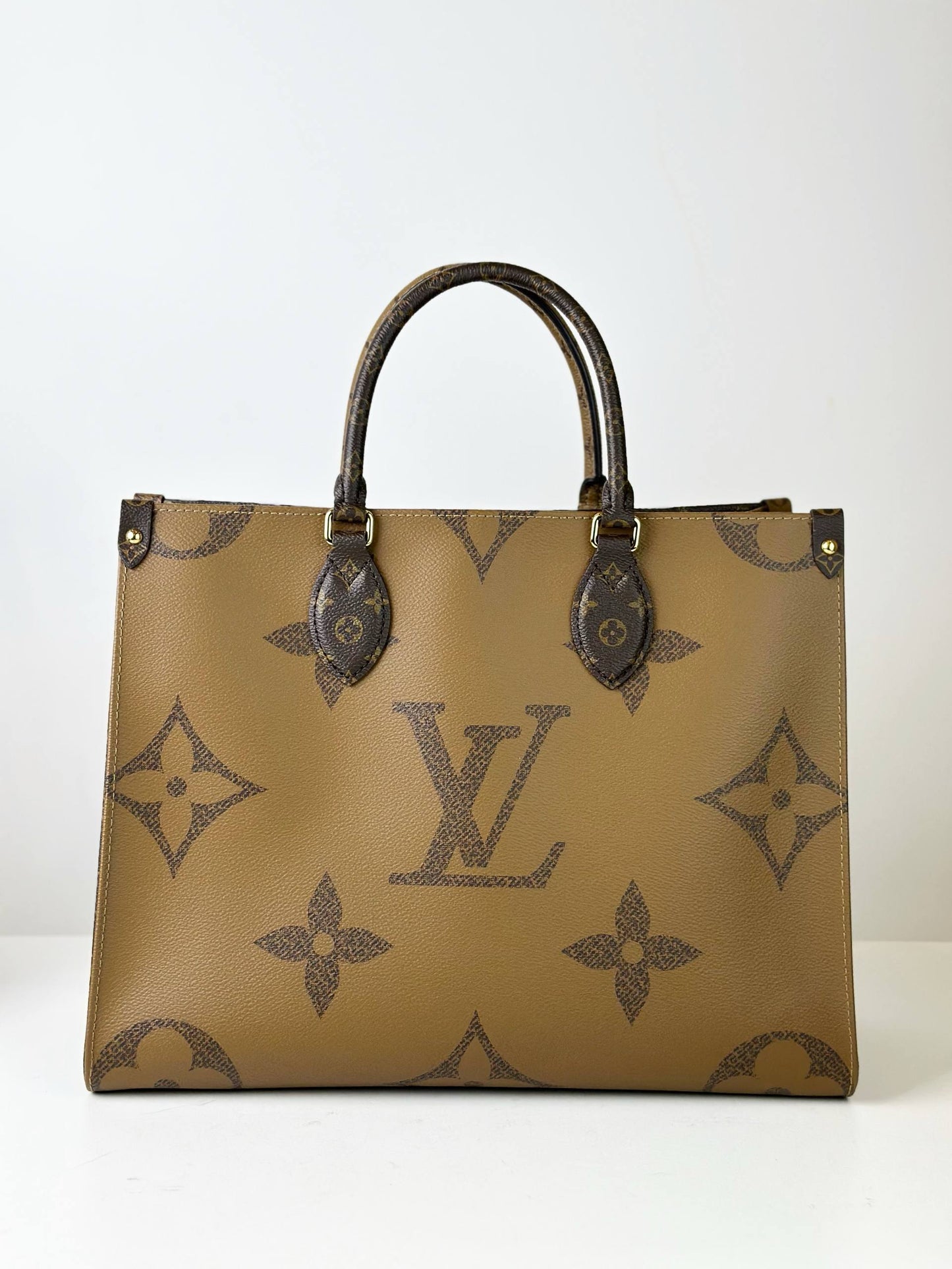 LOUIS VUITTON ONTHEGO MM REVERSE MONOGRAM HANDBAG