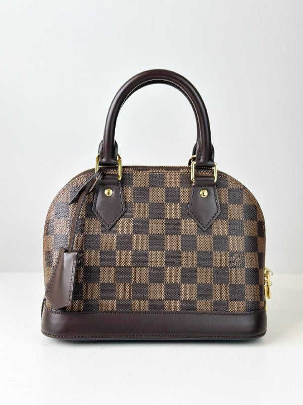 LOUIS VUITTON DAMIER EBENE ALMA BB HANDBAG WITH STRAP