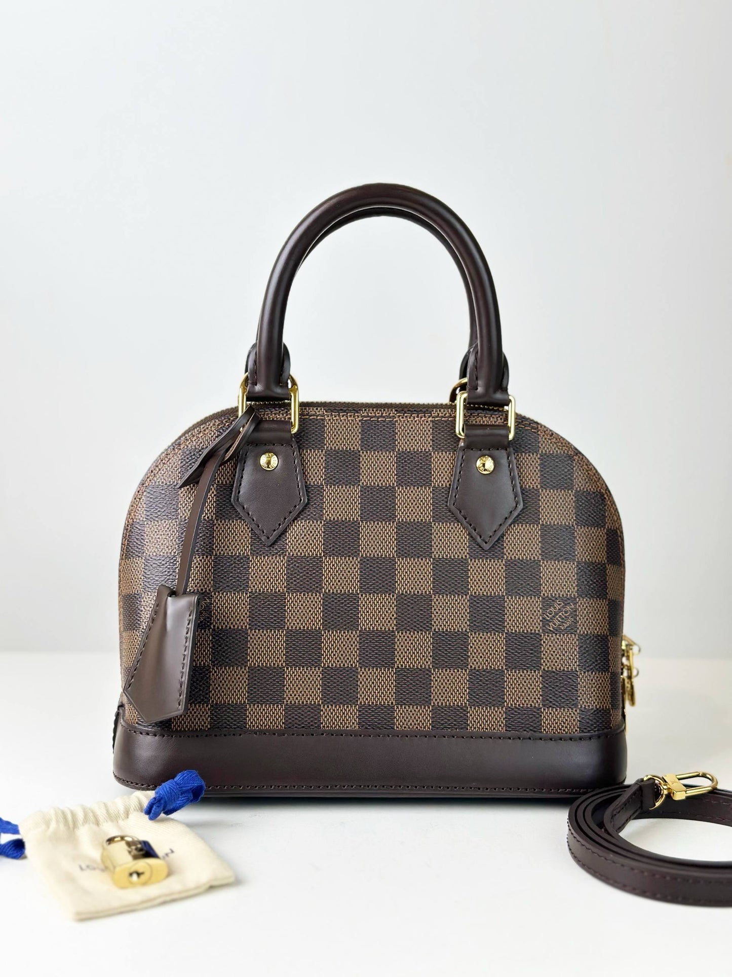 LOUIS VUITTON DAMIER EBENE ALMA BB HANDBAG WITH STRAP