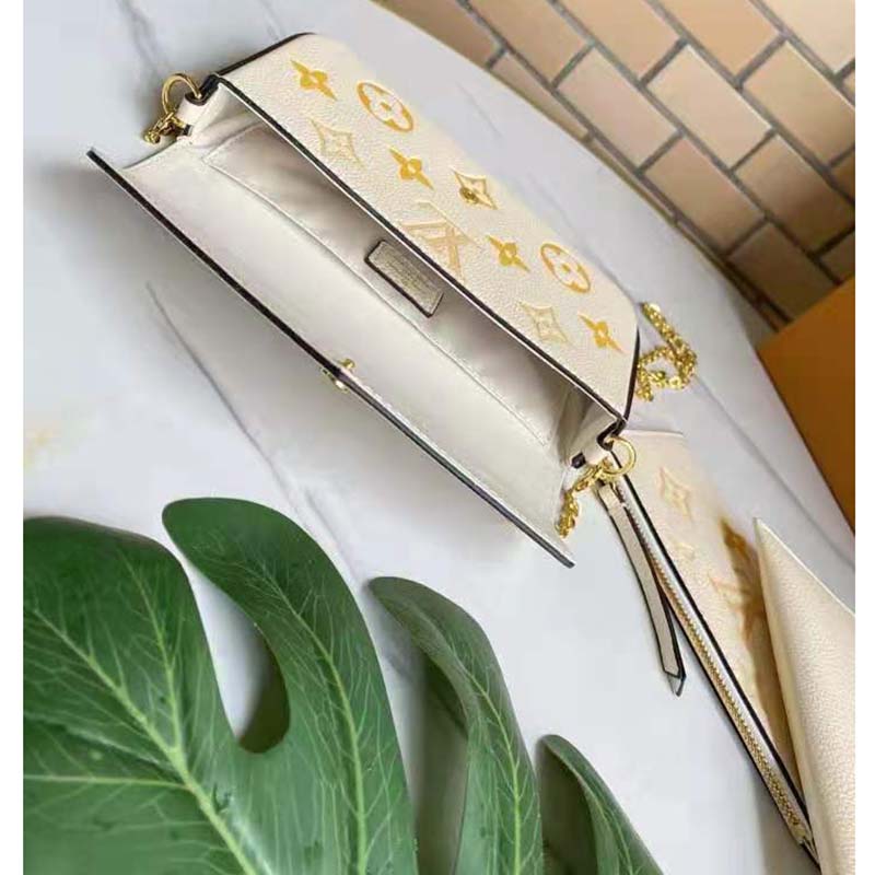 Louis Vuitton Women Félicie Pochette Cream Saffron Monogram Empreinte Embossed Supple Grained Cowhide Clutch