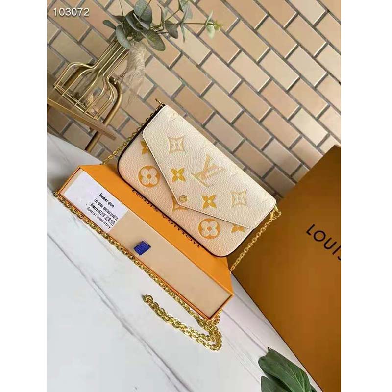 Louis Vuitton Women Félicie Pochette Cream Saffron Monogram Empreinte Embossed Supple Grained Cowhide Clutch