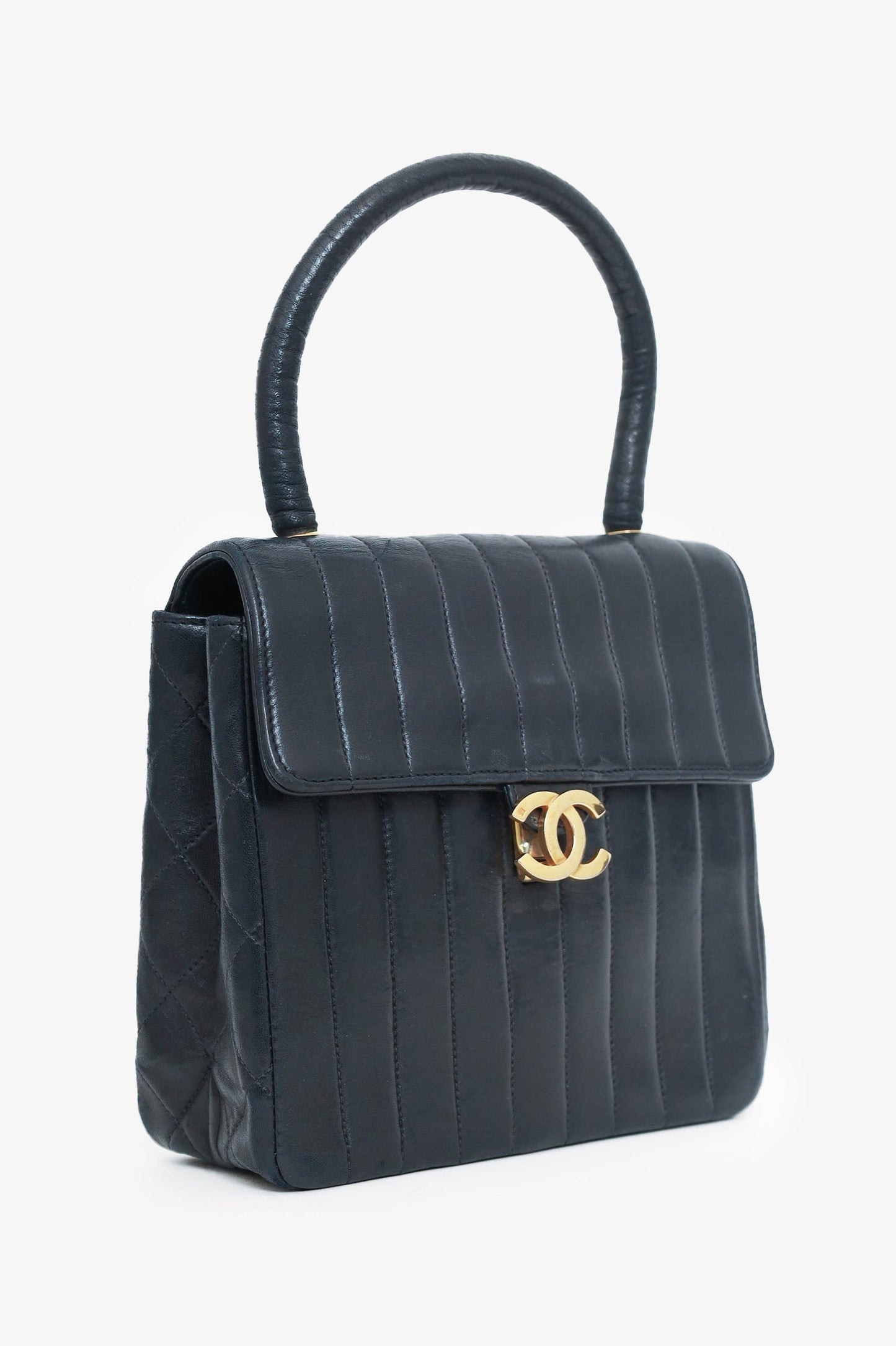 Chanel™ 1991-94 Black Vertical Quilted Lambskin Top Handle Bag