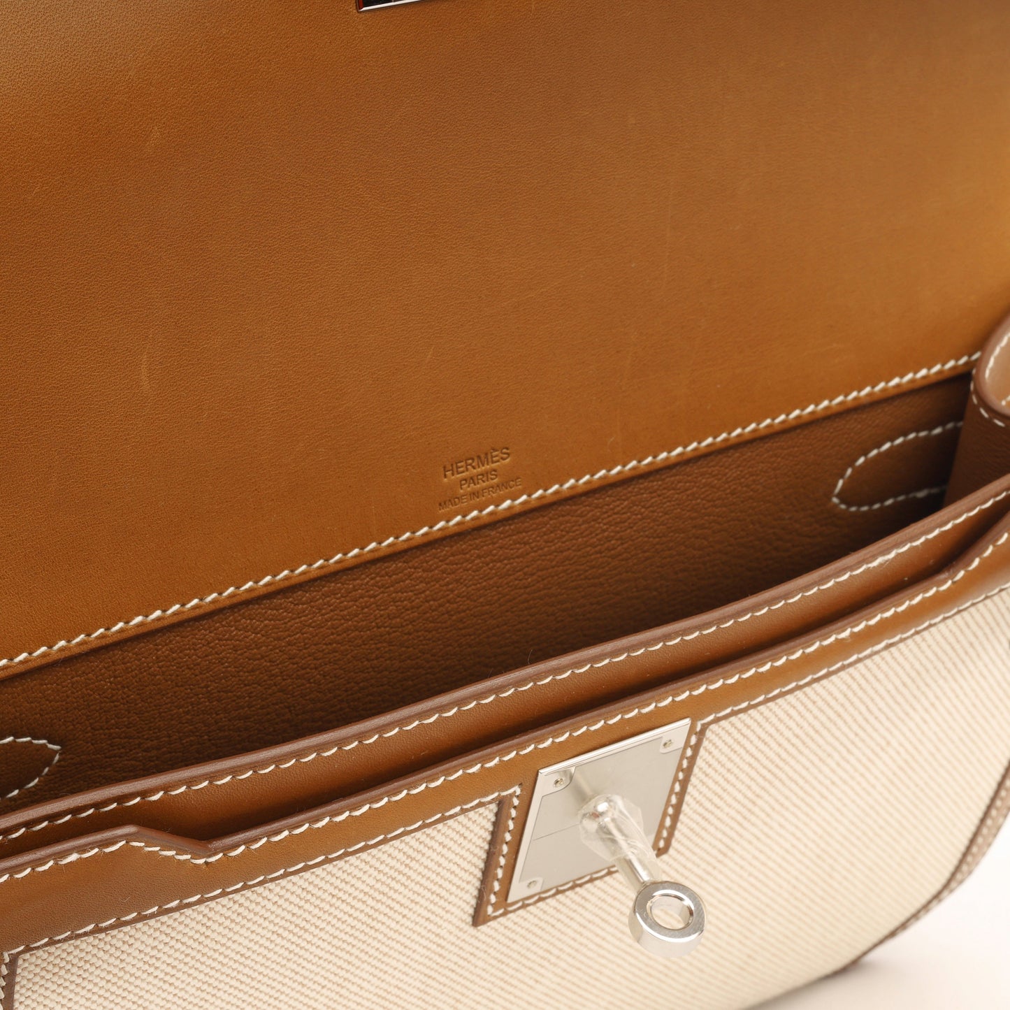 Hermès Kelly Dépêches 25 - Fauve Barenia/Ecru Toile | Palladium Hardware