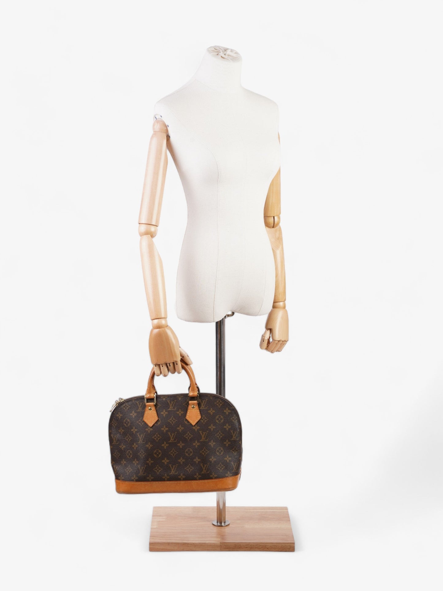 Louis Vuitton Alma Monogram Coated Canvas PM