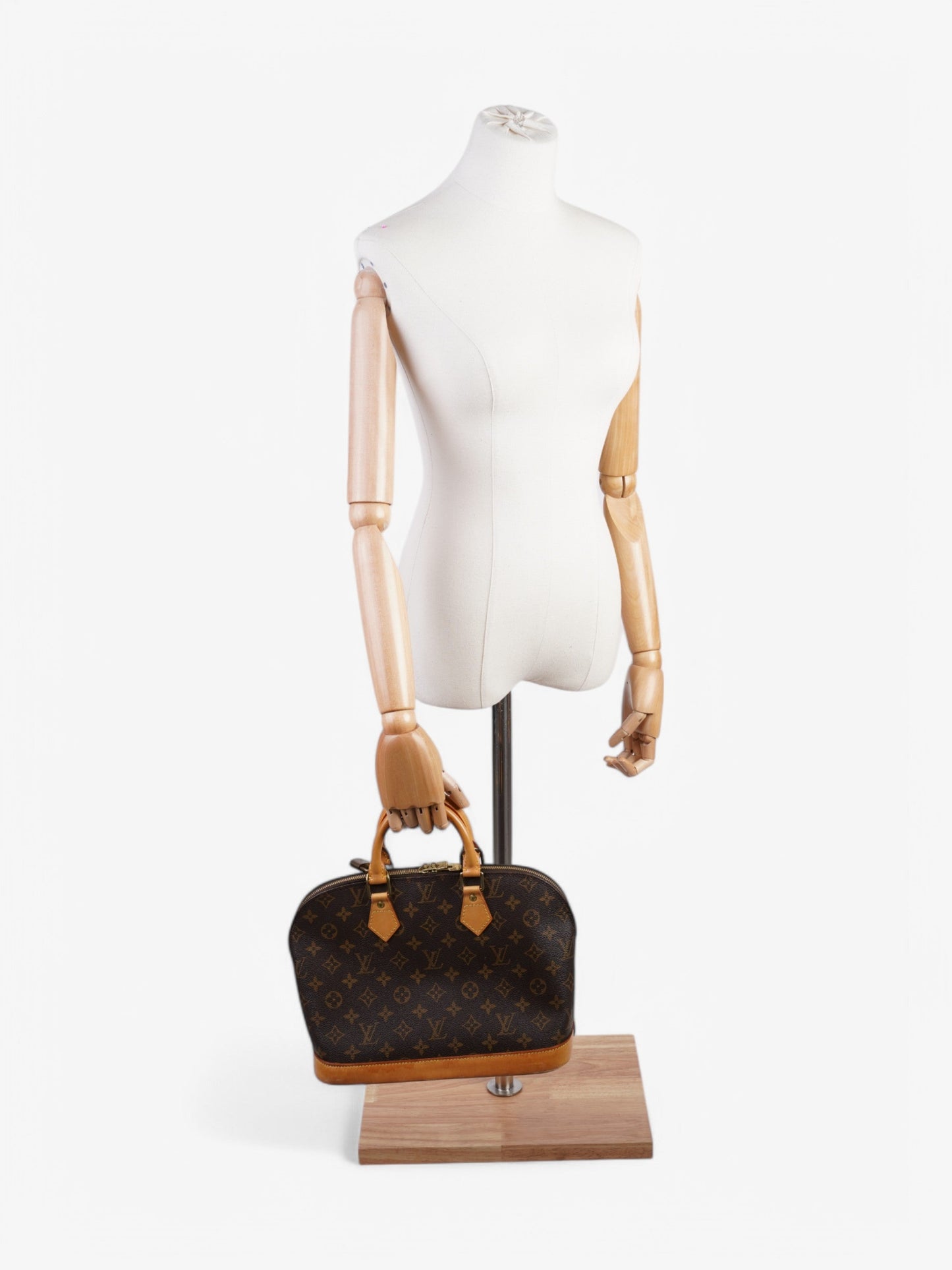 Louis Vuitton Alma Monogram Coated Canvas PM