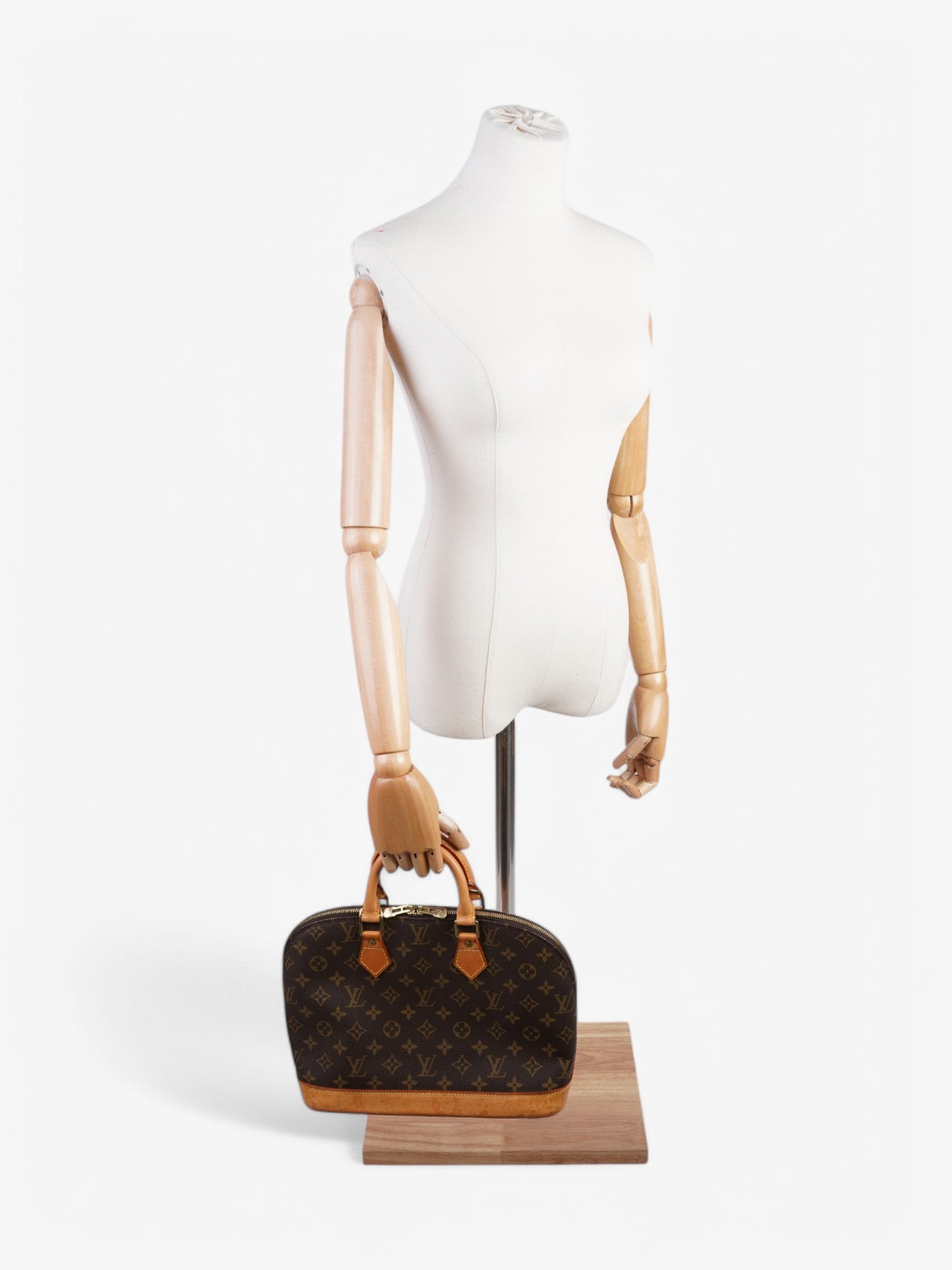 Louis Vuitton Alma Monogram Coated Canvas PM