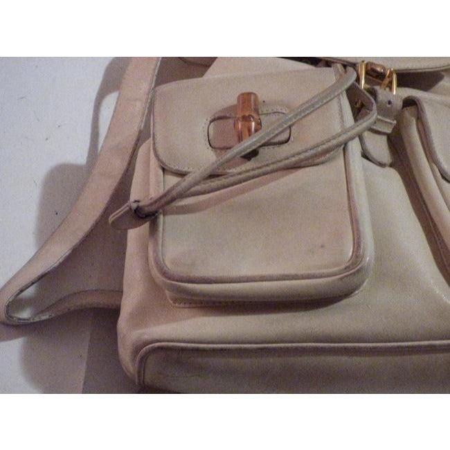 Gucci, white leather, larger size, two strap and bamboo handle, drawstring top, multi-pocket, messenger bag/backpack