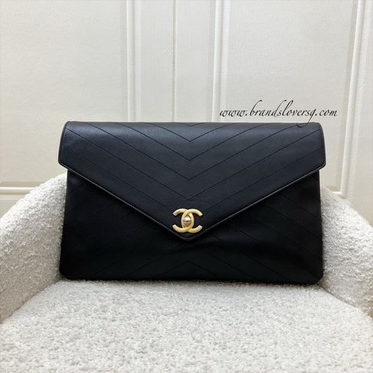 Chanel Clutch in Chevron Quilted Black Calf Leather and AGHW