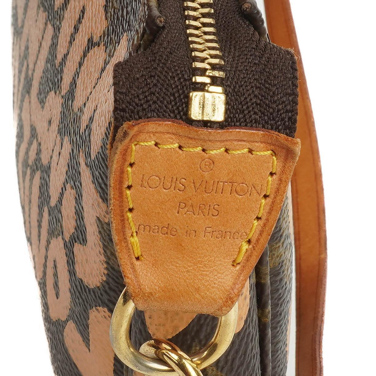 Louis Vuitton Pochette Accessoire in Monogram Graffiti Canvas Clutch Handbag a part of Stephen Sprouse collection