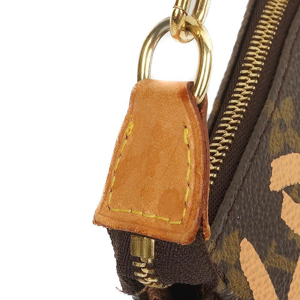 Louis Vuitton Pochette Accessoire in Monogram Graffiti Canvas Clutch Handbag a part of Stephen Sprouse collection