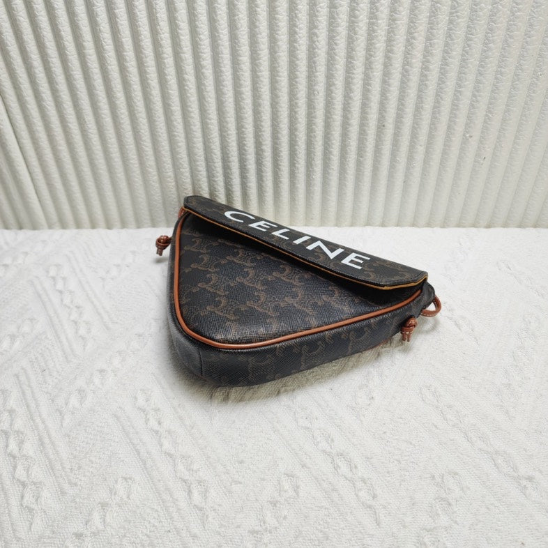 Luxury CELINE Triomphe Clutch in Brown Canvas